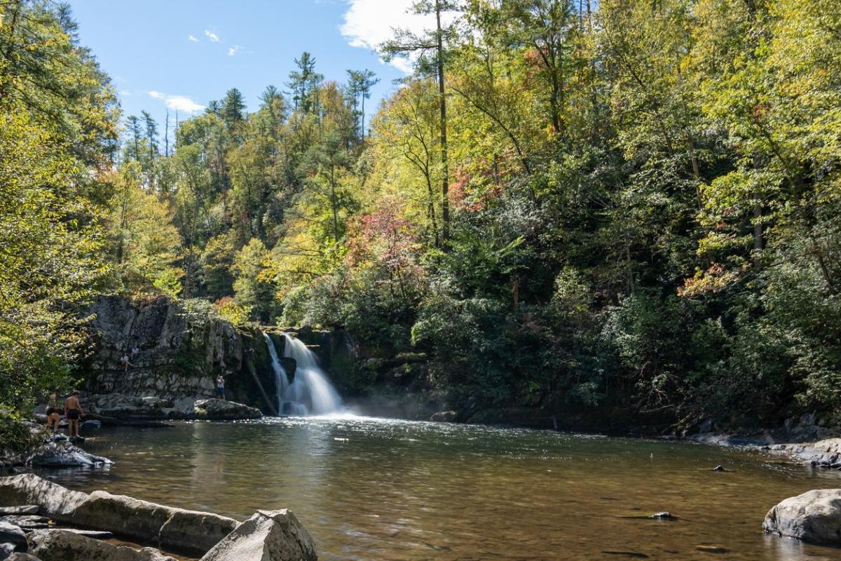 Family swimming at Abrams Falls in Cades Cove.